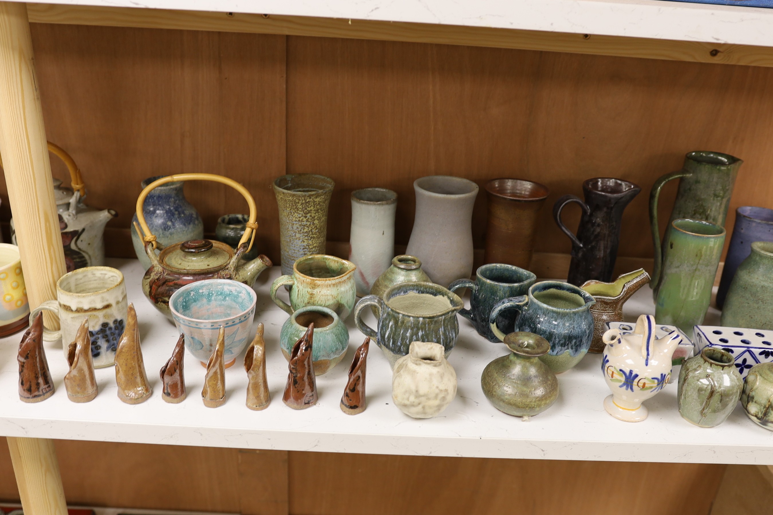 A large quantity of British studio pottery teapots, mugs, jugs and other miscellaneous items, to include a vast amount by Susan Threadgold